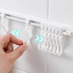 🏠50% OFF⏰ Multifunctional sliding hook, drill-free mounting, adjustable, ideal for kitchen & bathroom