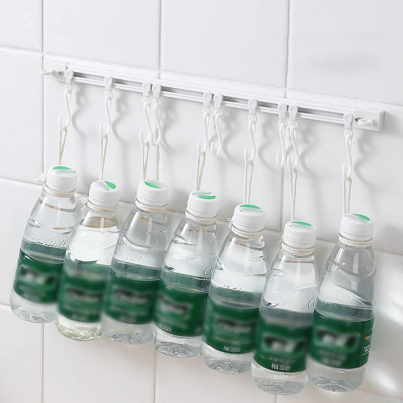 🏠50% OFF⏰ Multifunctional sliding hook, drill-free mounting, adjustable, ideal for kitchen & bathroom